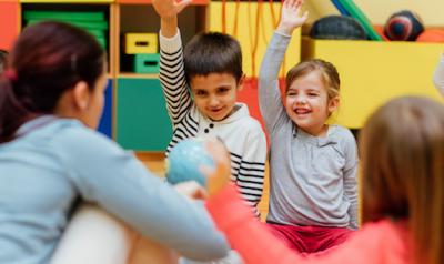 Preschool children sitting in a circle