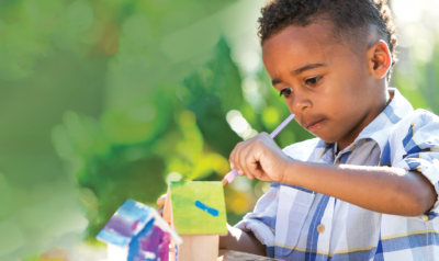 a child painting a craft project