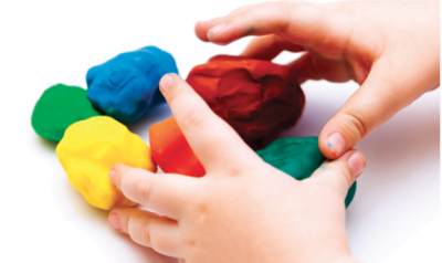 A child's hands with playdough.