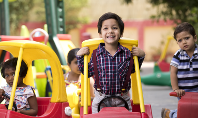 some kids playing with outdoor toys