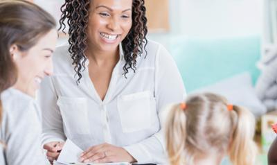 a parent and teacher with a child