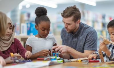 Teacher helping a student in the classroom