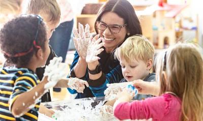 Teacher working with students in a classroom
