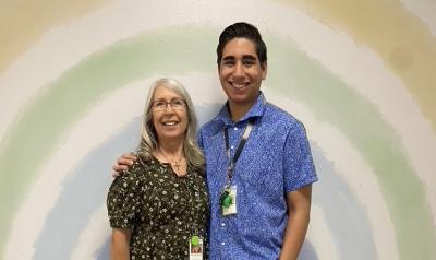 Two teachers posing with each other