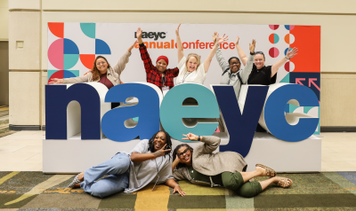 Annual Conference attendees with the NAEYC letter at AC2025