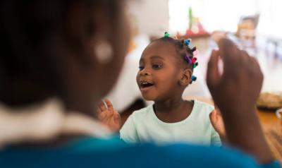 A young child singing