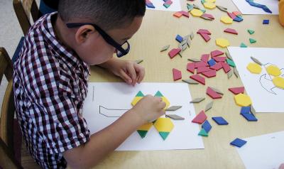 Child playing with materials