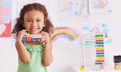 Girl smiling with toys