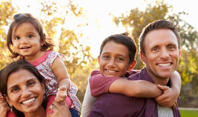 family of four outside in nature