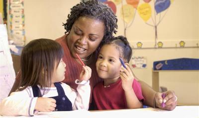 A teacher working with young children