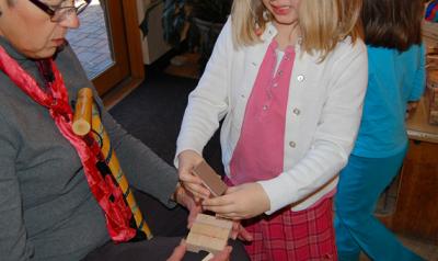 Child building blocks with an elderly woman