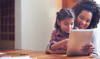 Mom and child reading from tablet