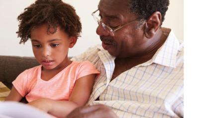 Child and parent reading a book