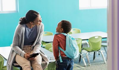 A teacher interacting with her student.