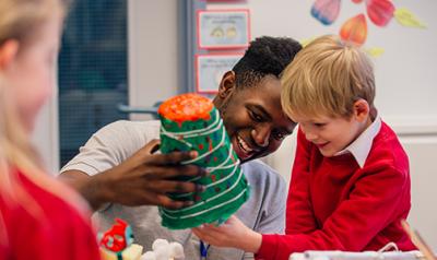 A teacher playing with his student.