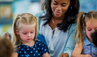 Teacher playing with her students