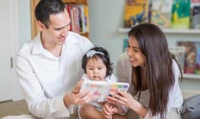 Family reading with toddler