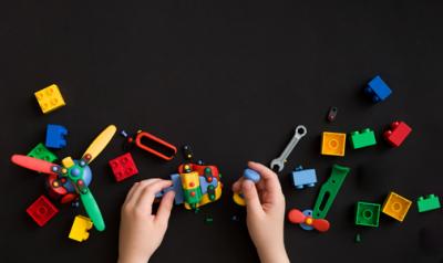 young child playing with legos