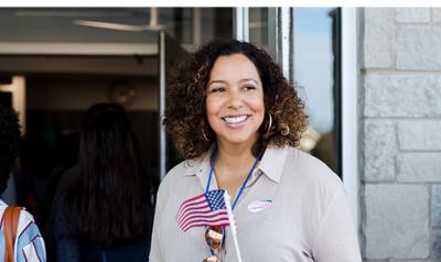 Individual standing outside voting building