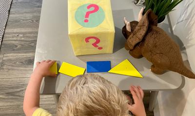 A child plays a shapes activity.