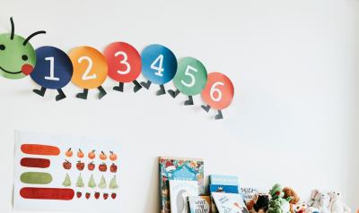 a paper caterpillar wall decoration in classroom