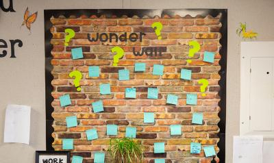 a wall with sticky notes on it