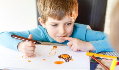 A young child drawing