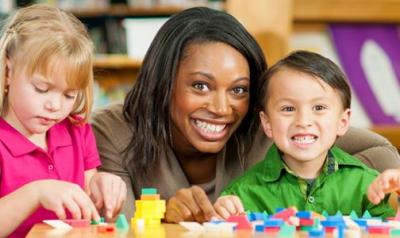 two children with a teacher