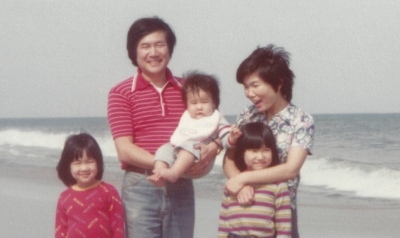 a vintage photo of a family at a beach