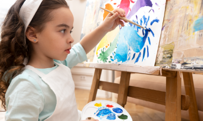 a child painting in class