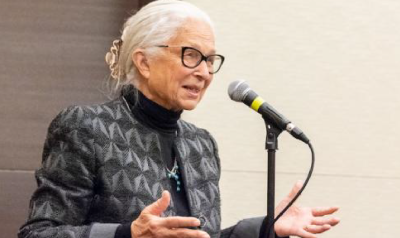 barbara bowman speaking into a microphone