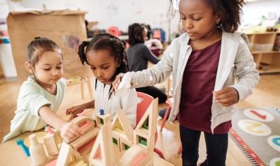 A group of children building with blocks