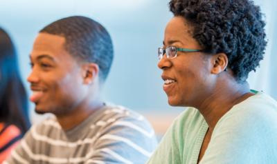 Early childhood professionals listen attentively to a lecture