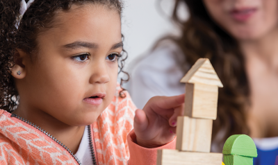 a child playing with blocks