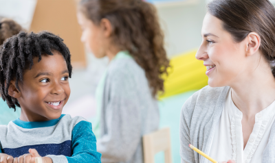 a teacher talking with a child