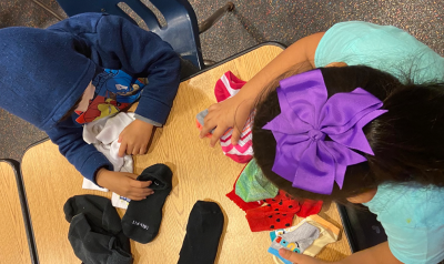 a child sharing family artifacts with the class