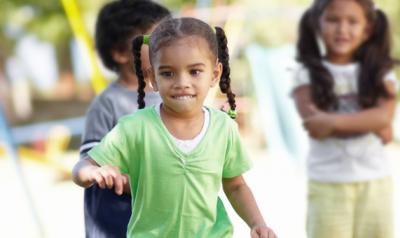 Children interact on a playground.