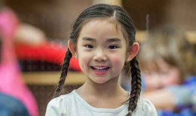 Little girl smiling while at school