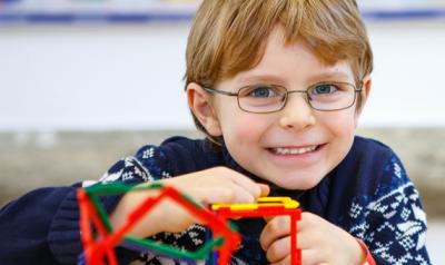 Young boy playing with educational toys