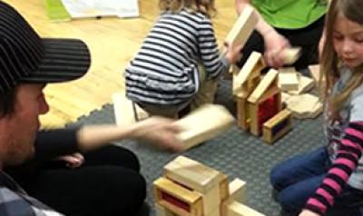 Young children playing with blocks in the classroom.