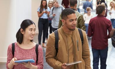 Young educators holding books