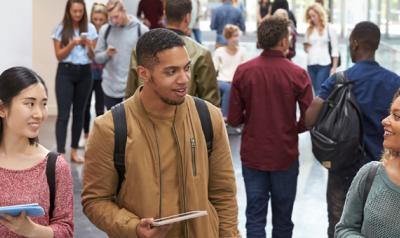 Young adults walking down a hall