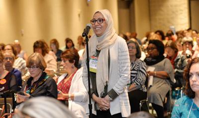 Woman addresses a group of early childhood educators.