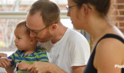 Parents singing with child