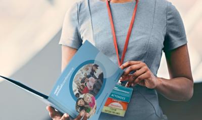 woman reviewing program at annual conference