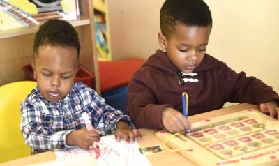 Two boys working at a table