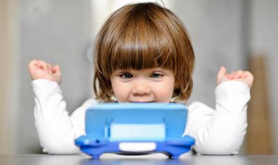 Child looking at a calculator