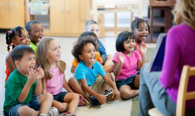 Children smiling and learning during circle time