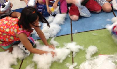 Children playing with pillows for maker fest