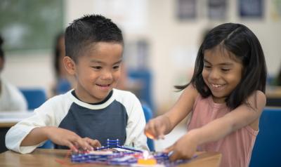 Two students working on a project in a classroom